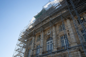 Building Construction With Scaffolding site in blue sky