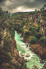 Amazing river landscape from Koprulu Canyon in Manavgat; Antalya; Turkey. Blue river. Rafting tourism. Koprucay. Beauty in nature. Dramatic scene.