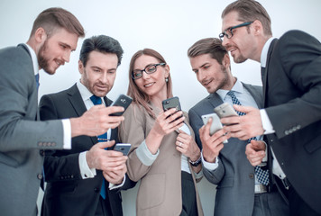 group of business people reading a message on phones
