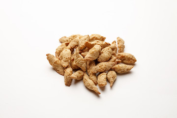 Dry soya meat chunks isolated on white