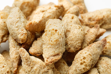 Dry soya meat chunks isolated on white