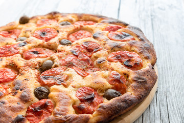 Focaccia typical of Bari Italy with tomatoes and olive