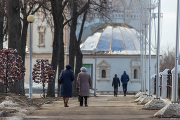 older women are walking down the street