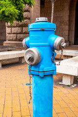 Fototapeta na wymiar A blue fire hydrant at downtown Sofia, Bulgaria