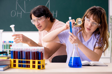 Two chemists students in classroom