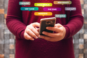 Customer Experience Concept. closeup women using Smartphone. Surrounded by Positive Review in Speech Bubble and Social Network icons