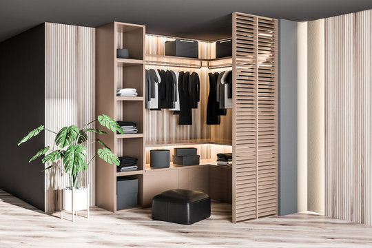 Modern wooden wardrobe with clothes