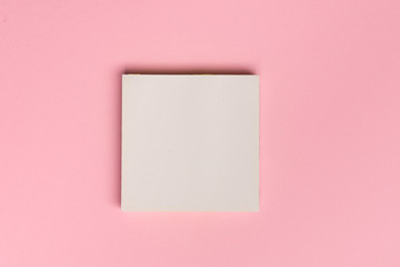 Top view flat lay picture with blank notepad page on colored surface