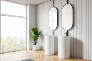 Modern light bathroom interior. Design mirrors