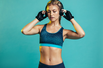 Muscular female with headphones