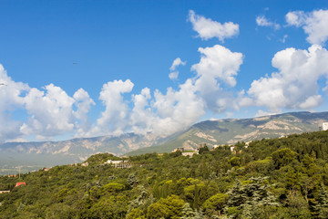 Fototapeta na wymiar Clouds over the mountain range.