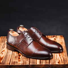 leather stylish men's shoes on a black background
