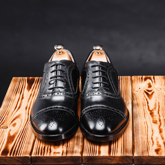 leather stylish men's shoes on a black background