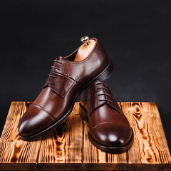 leather stylish men's shoes on a black background