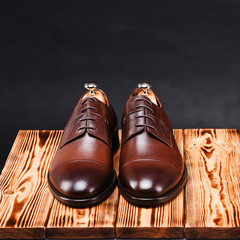 leather stylish men's shoes on a black background