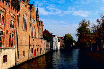 Fototapeta na wymiar Belgium, Bruges, brick houses on the canal
