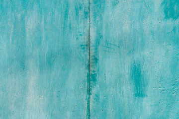 Imperfect metallic plate. Cracked paint close-up. Damage texture in macro. Grungy metal panel. Textured background. Rough faded uneven iron wall. Obsolete surface. Peeling of old paint. Flaking of dye