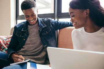 Students completing their class assignment