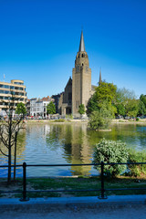 BRUSSELS, BELGIUM - MAY 6, 2018: Church of the holy cross, and Flagey building along Ixelles lakes