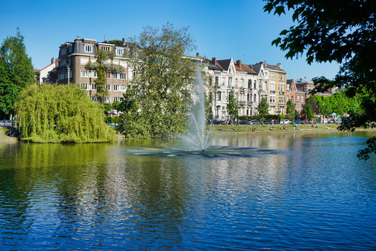 BRUSSELS, BELGIUM - MAY 6, 2018: Lake and trees along the shore, Flagey Avenue