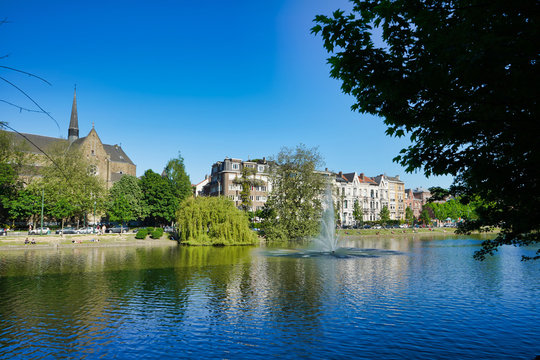 BRUSSELS, BELGIUM - MAY 6, 2018: Lake and trees along the shore, Flagey Avenue