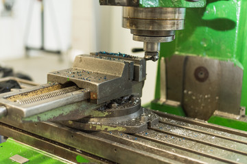 Worker at the factory with metal chips. Work at the factory