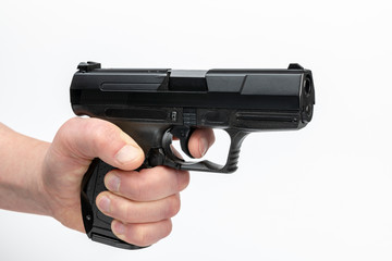 Hand with firearm.