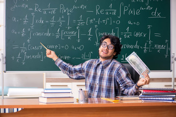Funny male math teacher in the classroom