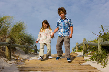 Two children on wooden path