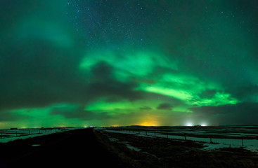 Northern lights Aurora Borealis above a road
