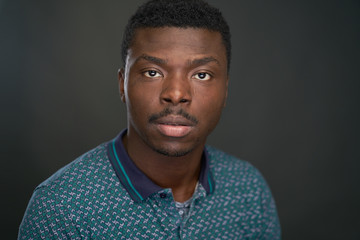 Obraz premium Portrait of black man with green tshirt