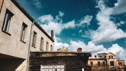 Abandoned old factory building under the blue cloudy sky in Czech Republic