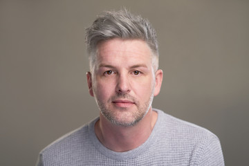 Obraz premium Portrait of caucasian man with grey hair in studio