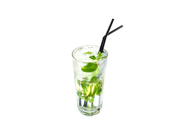 Mojito with lime and mint in a tall glass cup with a straw on an isolated white background