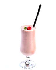 Fruit and berry pink smoothie in a tall glass, decorated with raspberry and mint on an isolated white background