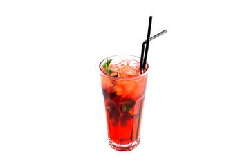 berry juice with ice in a tall glass with a straw decorated with mint on an isolated white background