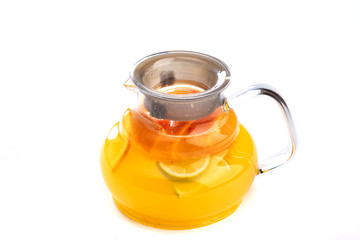 Citrus lemonade in a jug on an isolated white background