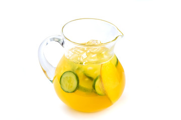 Lemonade with mango and cucumber in a jug on an isolated white background
