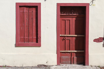 Fototapeta na wymiar old house wall with wooden door and window