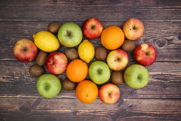 Healthy lifestyle - fruits and vegetables on wooden background