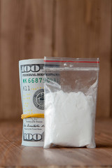 Stack of Money, drugsand on a wooden table. Drug use, crime, addiction and substance abuse concept on wooden background