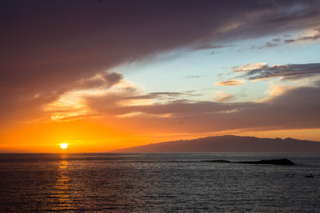 beautiful sunset over the Atlantic ocean at Costa Adaje, Tenerife Island, Spain
