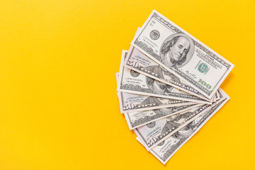 Money background. Lots of money dollar banknotes in yellow background.