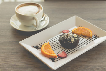 chocolate lava cake with fresh fruit and coffee