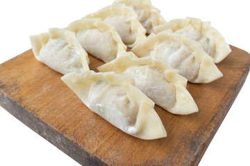 raw dumplings or gyoza isolated on white background