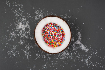 Coconut full of colorful sprinklers