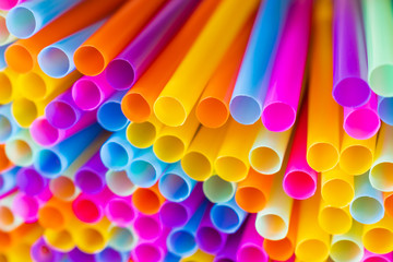 Close up to plenty colorful straws background