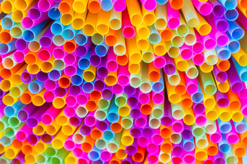 Close up to plenty colorful straws background