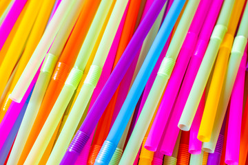 Close up to plenty colorful straws background