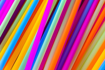 Close up to plenty colorful straws background